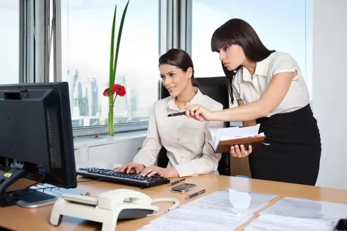 two-female-executives-working-in-office