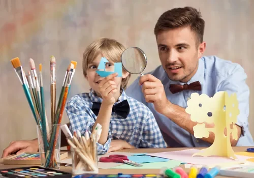 creative-male-babysitter-with-child