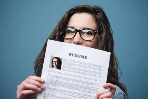 young-woman-holding-her-resume