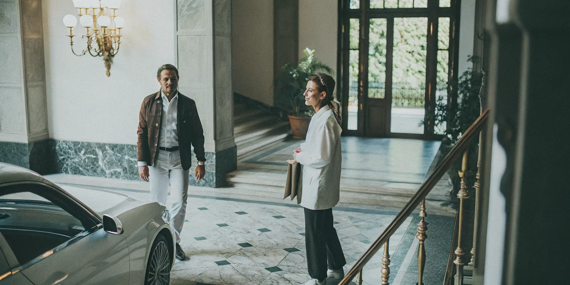 Elegant private household staff in a grand estate foyer