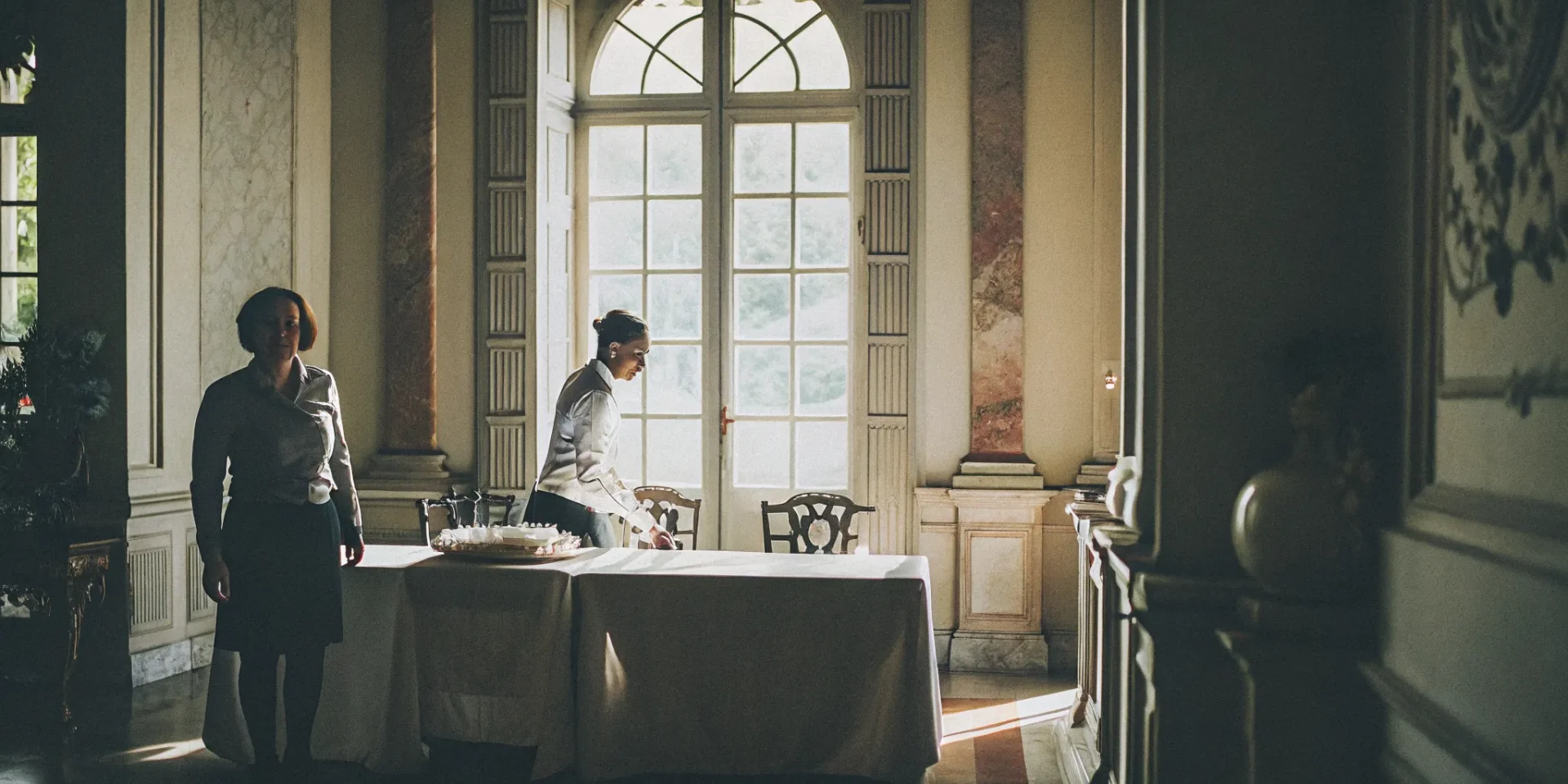 Elegant luxury estate interior with classical architecture and warm natural lighting